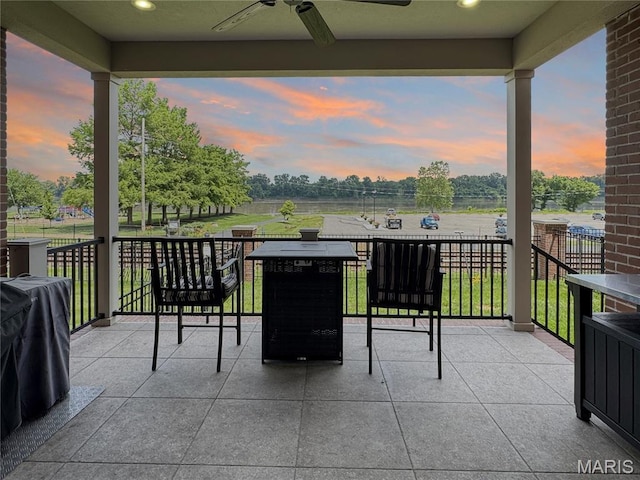 4 Market St, Washington, MO 63090 - patio terrace at dusk featuring a ceiling fan