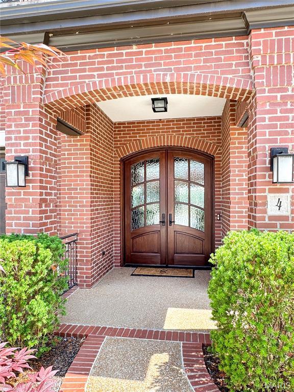 4 Market St, Washington, MO 63090 - doorway to property featuring brick siding and french doors
