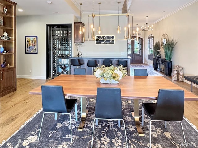 4 Market St, Washington, MO 63090 - dining space featuring ornamental molding, wood finished floors, and a chandelier