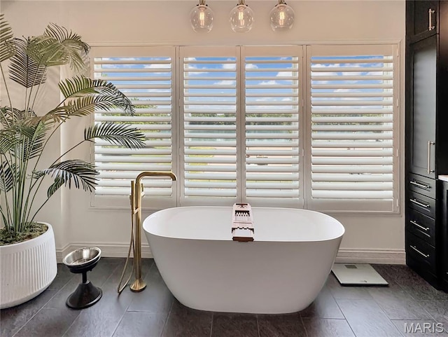 4 Market St, Washington, MO 63090 - full bathroom with a freestanding bath and tile patterned floors