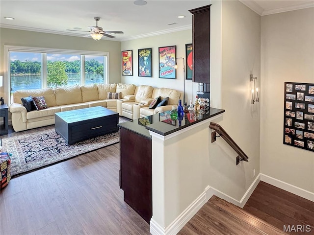 4 Market St, Washington, MO 63090 - living room with a ceiling fan, wood finished floors, crown molding, and recessed lighting