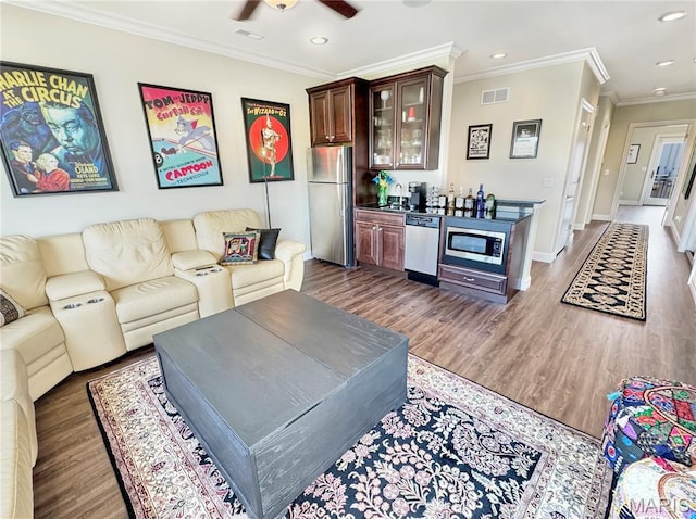 4 Market St, Washington, MO 63090 - living area featuring recessed lighting, ornamental molding, a ceiling fan, wood finished floors, and bar area