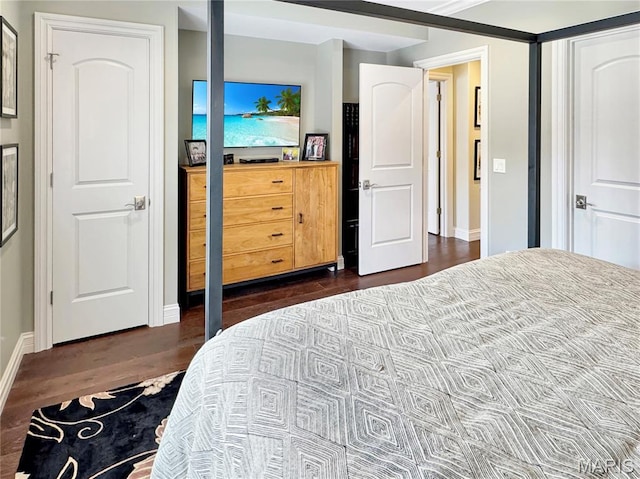 4 Market St, Washington, MO 63090 - bedroom featuring baseboards and dark wood-style floors