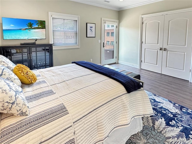 4 Market St, Washington, MO 63090 - bedroom featuring ornamental molding, wood finished floors, and access to exterior