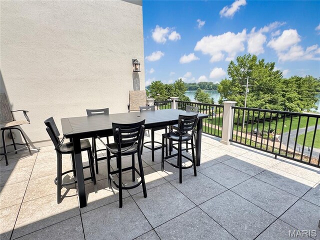 4 Market St, Washington, MO 63090 - view of patio with outdoor dining space and a water view