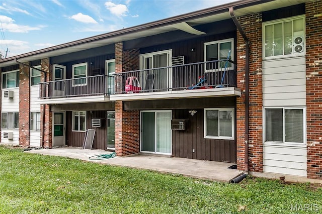 8733 Sieloff Dr Unit C, Hazelwood, MO 63042 - rear view of property with a yard, a balcony, brick siding, and a patio