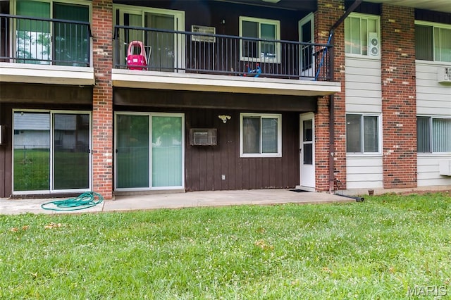 8733 Sieloff Dr Unit C, Hazelwood, MO 63042 - rear view of property featuring a lawn and a balcony