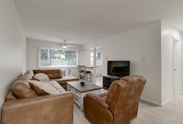 8733 Sieloff Dr Unit C, Hazelwood, MO 63042 - living area featuring light wood-style floors and a ceiling fan