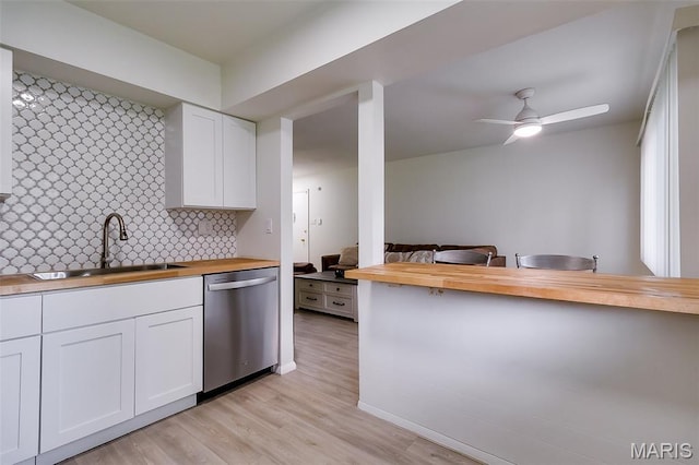 8733 Sieloff Dr Unit C, Hazelwood, MO 63042 - kitchen featuring wooden counters, white cabinetry, stainless steel dishwasher, backsplash, and light wood-type flooring