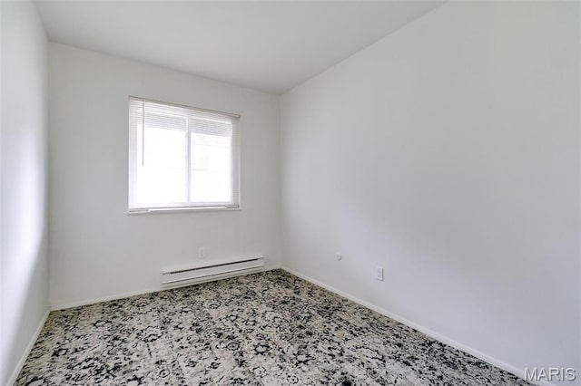 8733 Sieloff Dr Unit C, Hazelwood, MO 63042 - spare room featuring a baseboard heating unit and carpet