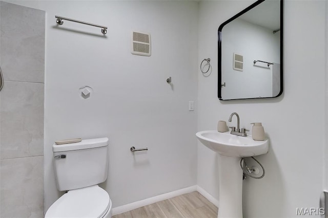8733 Sieloff Dr Unit C, Hazelwood, MO 63042 - bathroom with toilet and wood finished floors
