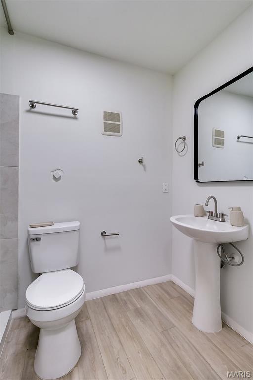 8733 Sieloff Dr Unit C, Hazelwood, MO 63042 - bathroom with wood finished floors and toilet