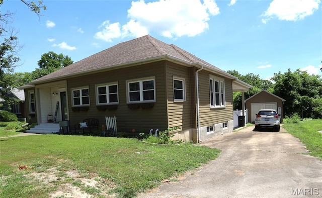 158 Church St, Bonne Terre, MO 63628 - view of front facade featuring a detached garage, a front lawn, an outdoor structure, and driveway