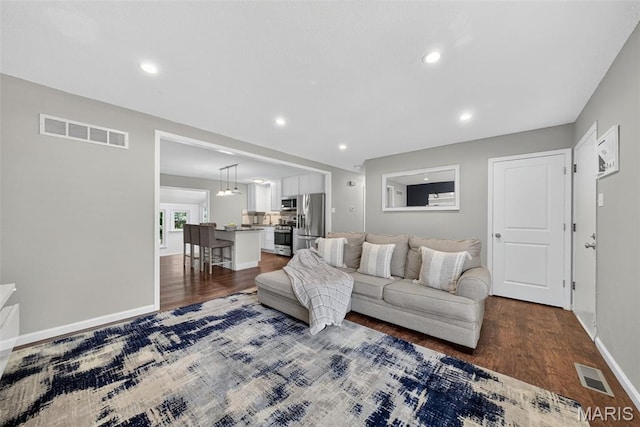 1002 Arlington Dr, Saint Charles, MO 63303 - living room with dark wood-type flooring and recessed lighting