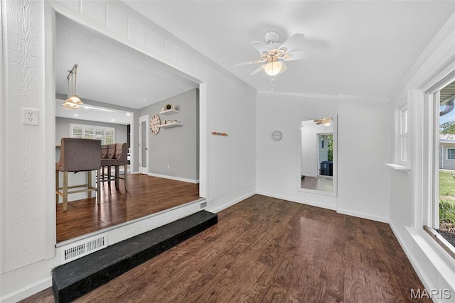 1002 Arlington Dr, Saint Charles, MO 63303 - empty room with ceiling fan, wood finished floors, and crown molding