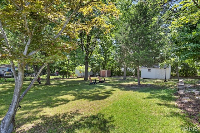 1002 Arlington Dr, Saint Charles, MO 63303 - view of grassy yard with a storage shed