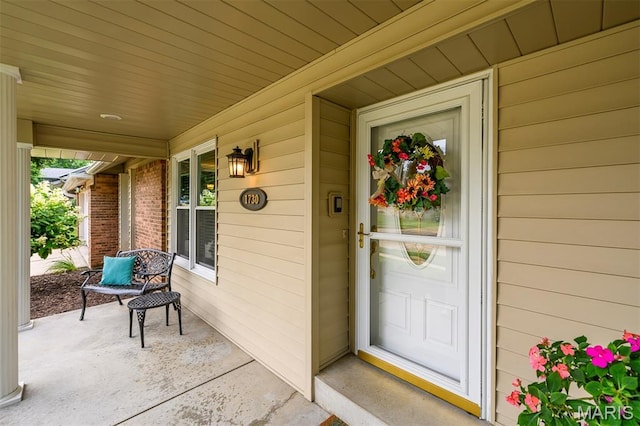 1730 Blakefield Ter, Manchester, MO 63021 - doorway to property featuring covered porch and brick siding