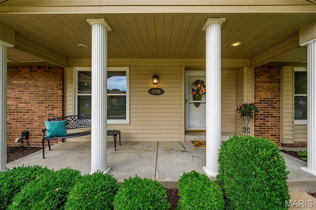 1730 Blakefield Ter, Manchester, MO 63021 - property entrance featuring covered porch and brick siding