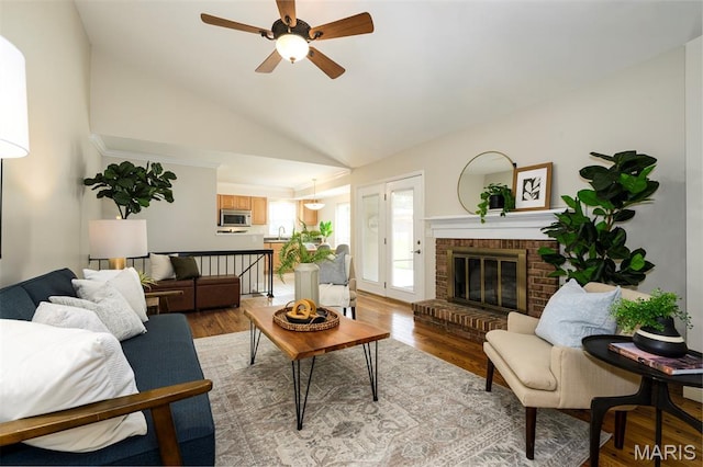 1730 Blakefield Ter, Manchester, MO 63021 - living room with ceiling fan, light wood-style flooring, a fireplace, and high vaulted ceiling