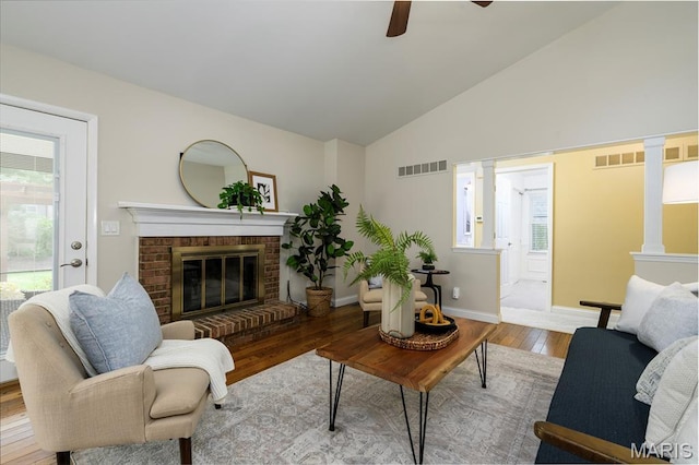 1730 Blakefield Ter, Manchester, MO 63021 - living area featuring hardwood / wood-style floors, ceiling fan, healthy amount of natural light, a fireplace, and high vaulted ceiling