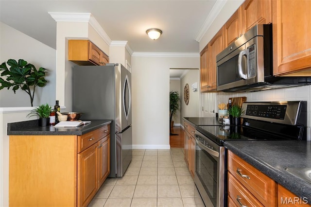 1730 Blakefield Ter, Manchester, MO 63021 - kitchen featuring stainless steel appliances, dark countertops, light tile patterned floors, brown cabinetry, and ornamental molding