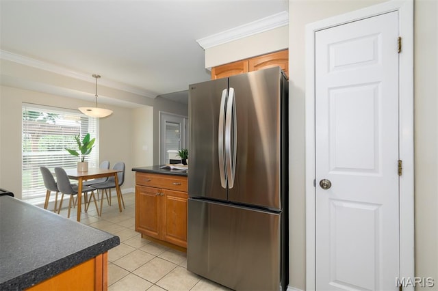 1730 Blakefield Ter, Manchester, MO 63021 - kitchen featuring freestanding refrigerator, dark countertops, crown molding, light tile patterned flooring, and pendant lighting