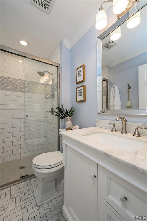 1730 Blakefield Ter, Manchester, MO 63021 - bathroom with crown molding, a stall shower, vanity, and recessed lighting