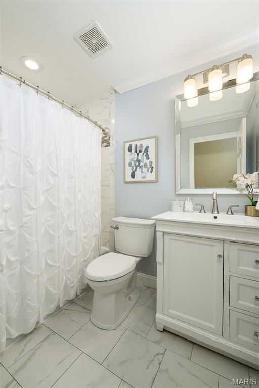 1730 Blakefield Ter, Manchester, MO 63021 - full bathroom featuring marble look tile flooring, vanity, ornamental molding, recessed lighting, and a shower with curtain