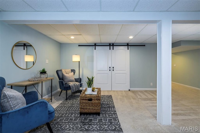 1730 Blakefield Ter, Manchester, MO 63021 - living room featuring light carpet, a paneled ceiling, a barn door, and recessed lighting