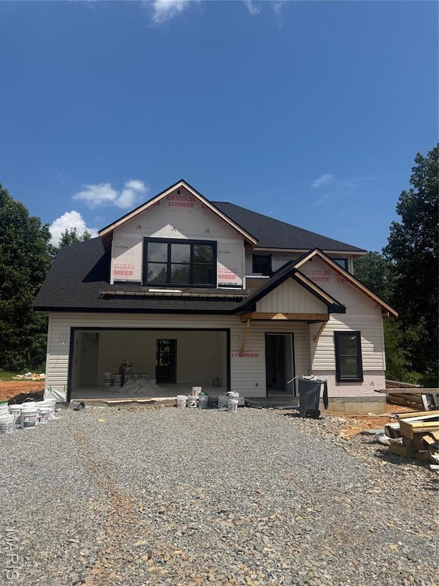 269 Berkshire Dr, Poplar Bluff, MO 63901 - property in mid-construction featuring covered porch, an attached garage, and gravel driveway