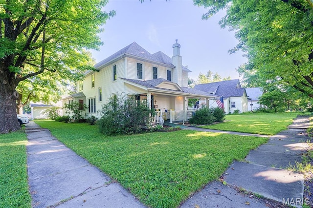131 W James Blvd, St James, MO 65559 - view of front facade with a chimney, a porch, and a front lawn