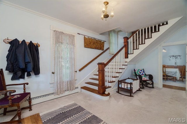 131 W James Blvd, St James, MO 65559 - carpeted foyer entrance featuring stairs, a chandelier, crown molding, and baseboard heating