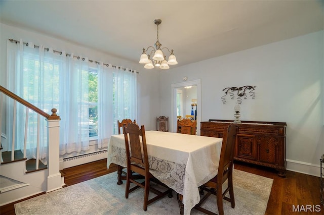 131 W James Blvd, St James, MO 65559 - dining area with a chandelier, stairs, a baseboard radiator, and wood finished floors