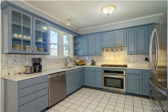 131 W James Blvd, St James, MO 65559 - kitchen with stainless steel appliances, ornamental molding, blue cabinetry, decorative backsplash, and light countertops