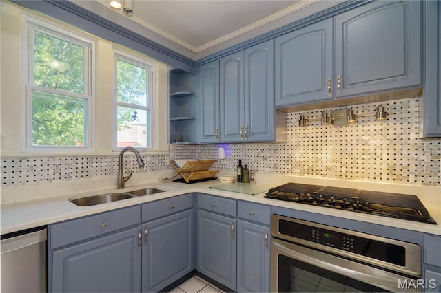 131 W James Blvd, St James, MO 65559 - kitchen with appliances with stainless steel finishes, tasteful backsplash, ornamental molding, light countertops, and blue cabinets