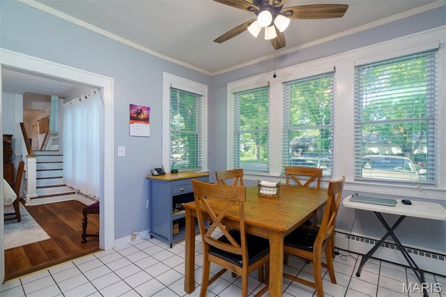 131 W James Blvd, St James, MO 65559 - dining space featuring a baseboard heating unit, ceiling fan, crown molding, light tile patterned floors, and stairs