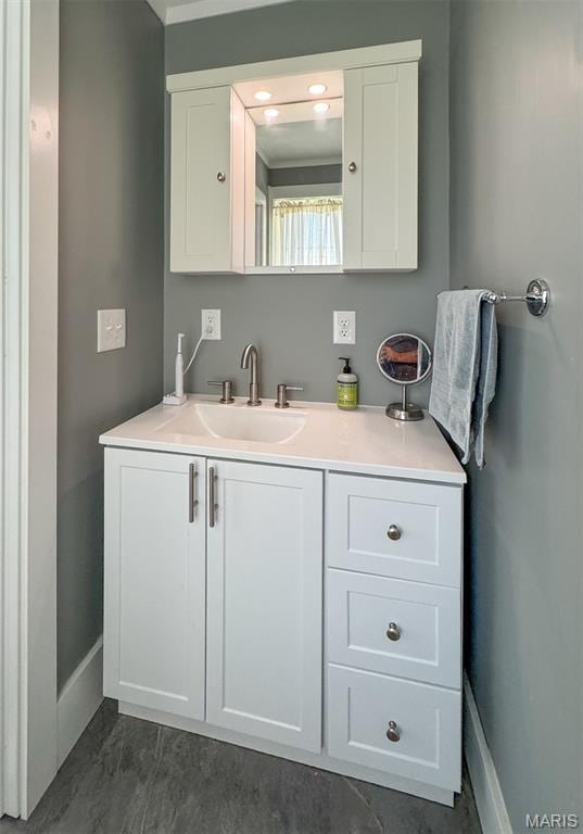 131 W James Blvd, St James, MO 65559 - bathroom with baseboards and vanity