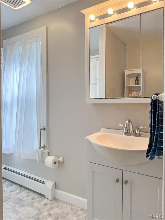 131 W James Blvd, St James, MO 65559 - bathroom with baseboard heating and vanity