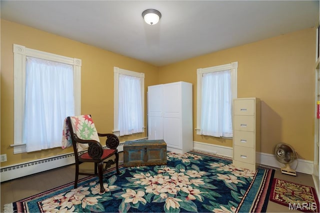 131 W James Blvd, St James, MO 65559 - sitting room featuring baseboards and a baseboard heating unit
