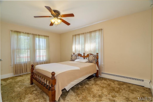 131 W James Blvd, St James, MO 65559 - carpeted bedroom featuring baseboard heating and a ceiling fan