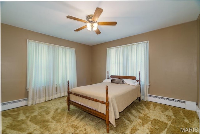 131 W James Blvd, St James, MO 65559 - bedroom with a baseboard radiator, carpet, a baseboard heating unit, and ceiling fan