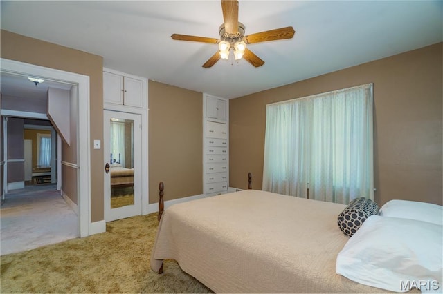 131 W James Blvd, St James, MO 65559 - bedroom with light colored carpet and a ceiling fan
