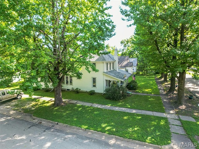 131 W James Blvd, St James, MO 65559 - view of property exterior with a yard and a chimney