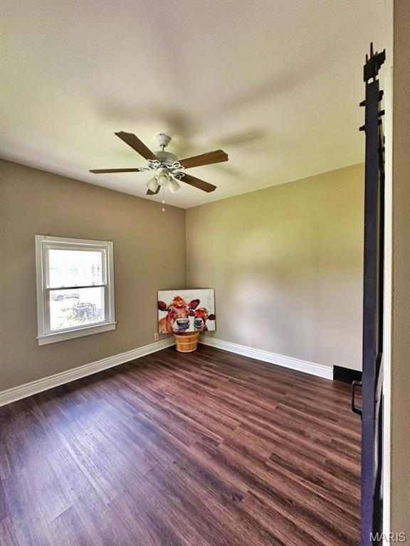 1604 Quendo Ave, Saint Louis, MO 63130 - spare room featuring wood finished floors and ceiling fan