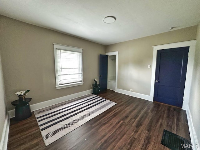 1604 Quendo Ave, Saint Louis, MO 63130 - unfurnished bedroom with wood finished floors and baseboards