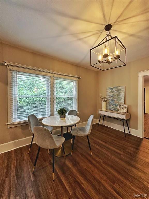 1604 Quendo Ave, Saint Louis, MO 63130 - dining space featuring wood finished floors and a chandelier