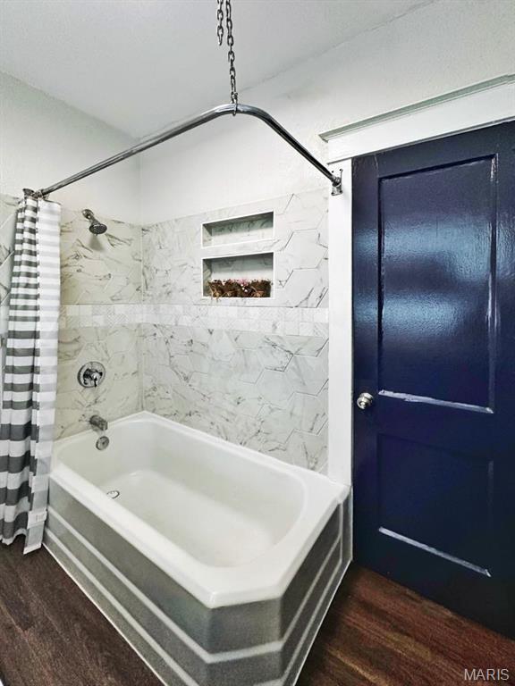 1604 Quendo Ave, Saint Louis, MO 63130 - full bathroom featuring wood finished floors and shower / bath combo with shower curtain