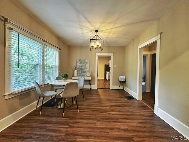 1604 Quendo Ave, Saint Louis, MO 63130 - dining area with a chandelier and dark wood-type flooring