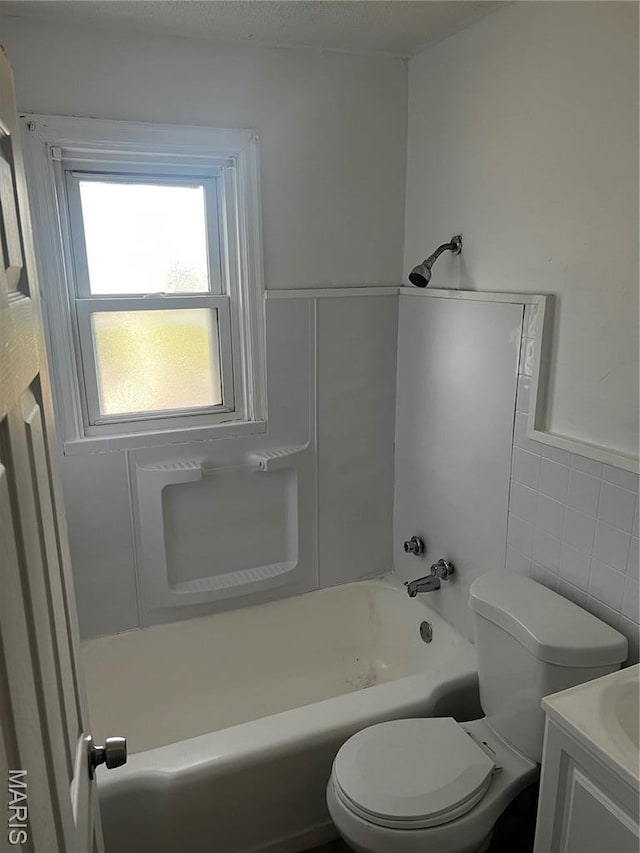 5209 College Ave, Jennings, MO 63136 - bathroom with vanity, tile walls, and shower / tub combination