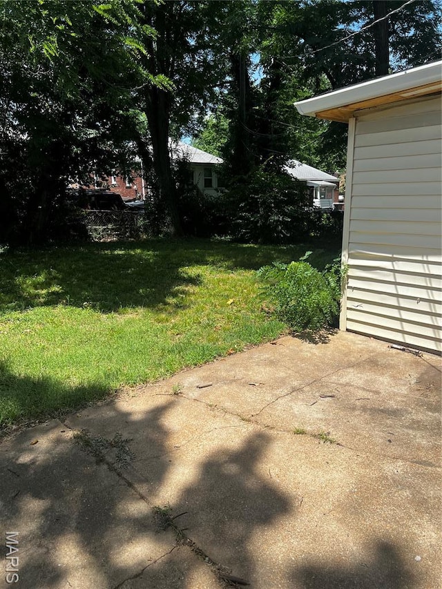 5209 College Ave, Jennings, MO 63136 - view of grassy yard with a patio